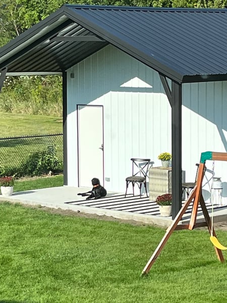 Barndominium-style metal home with attached shop space