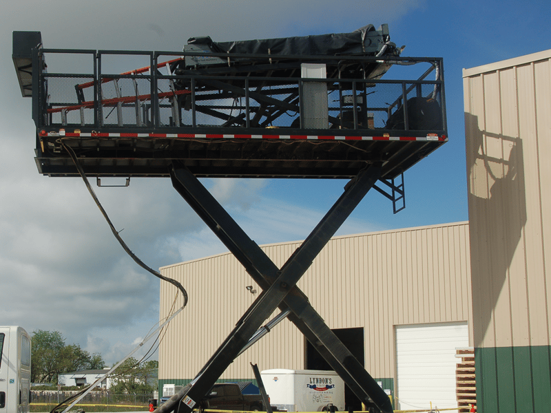 Onsite rollforming machine producing standing seam metal roof panels