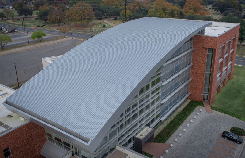 Aerial view of a facility with a metal roof