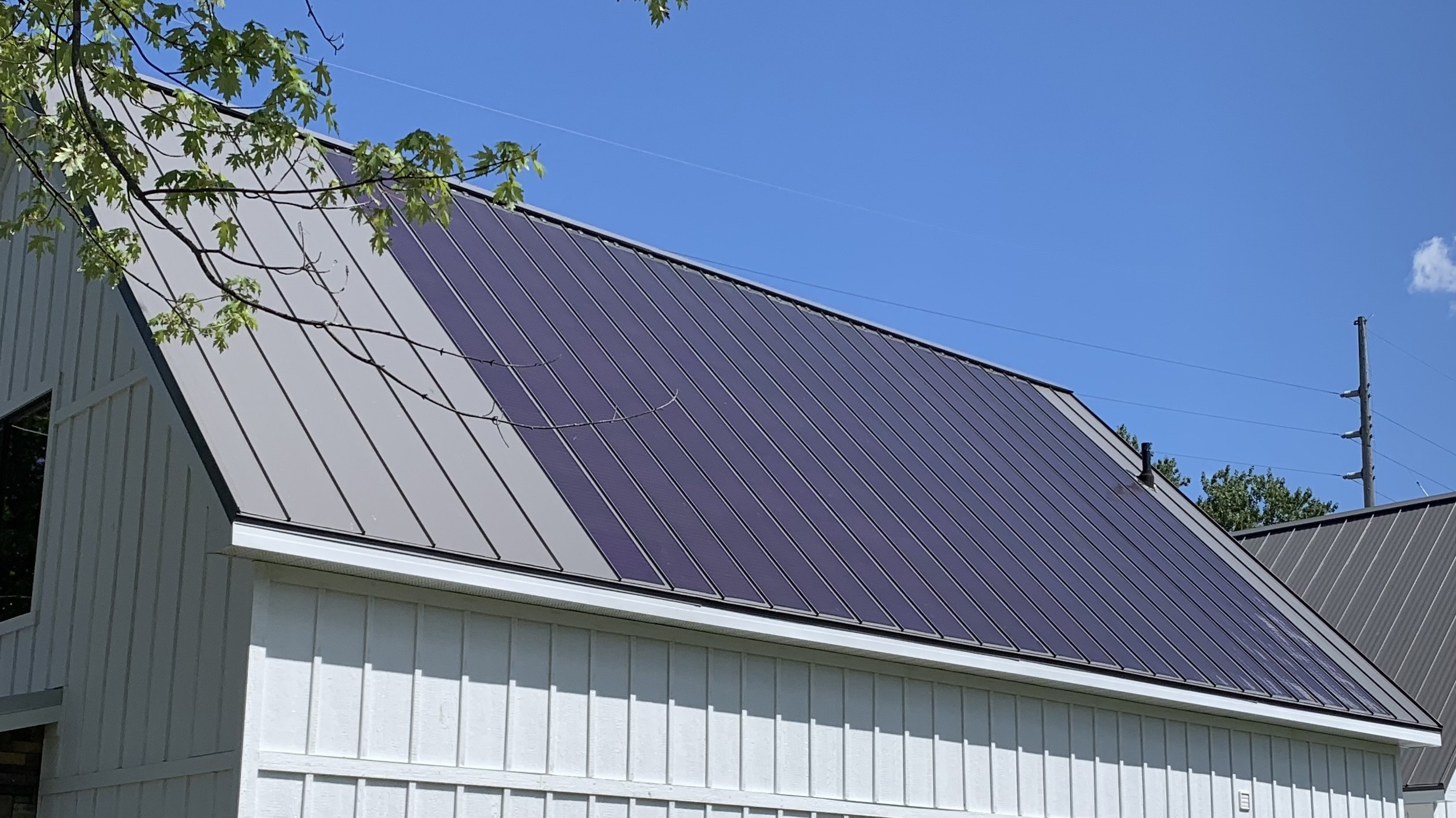 MiaSole thin-film solar laminate panels bonded to a striated standing seam metal roof